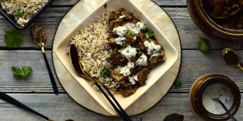 Homemade Chicken bhuna curry served with brown rice and raita