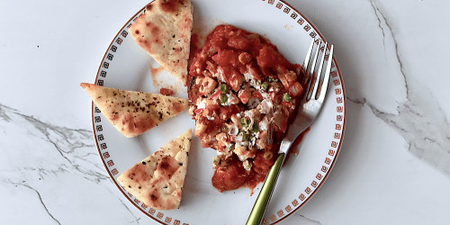 Indian stuffed Mushroom, with spicy tomato sauce and a slice of naan