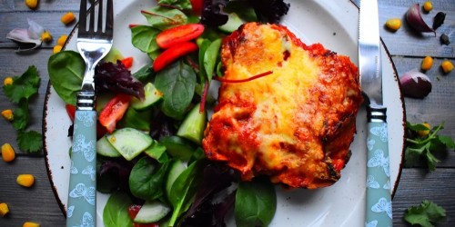 Mexican beef enchiladas with a tomato and green salad