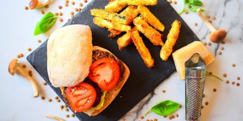 Mushroom and lentil burgers served with cheesy courgette chips