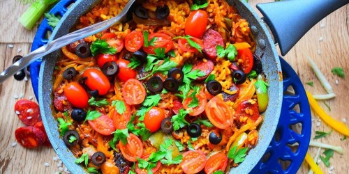 Spanish chicken and chorizo paella with vegetables and olives