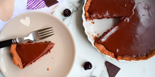 Cherry chocolate pie served with fresh cream
