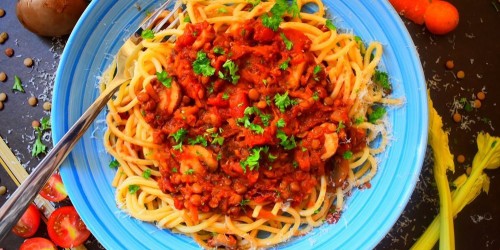 Green lentil bolognese on a bed of spaghetti
