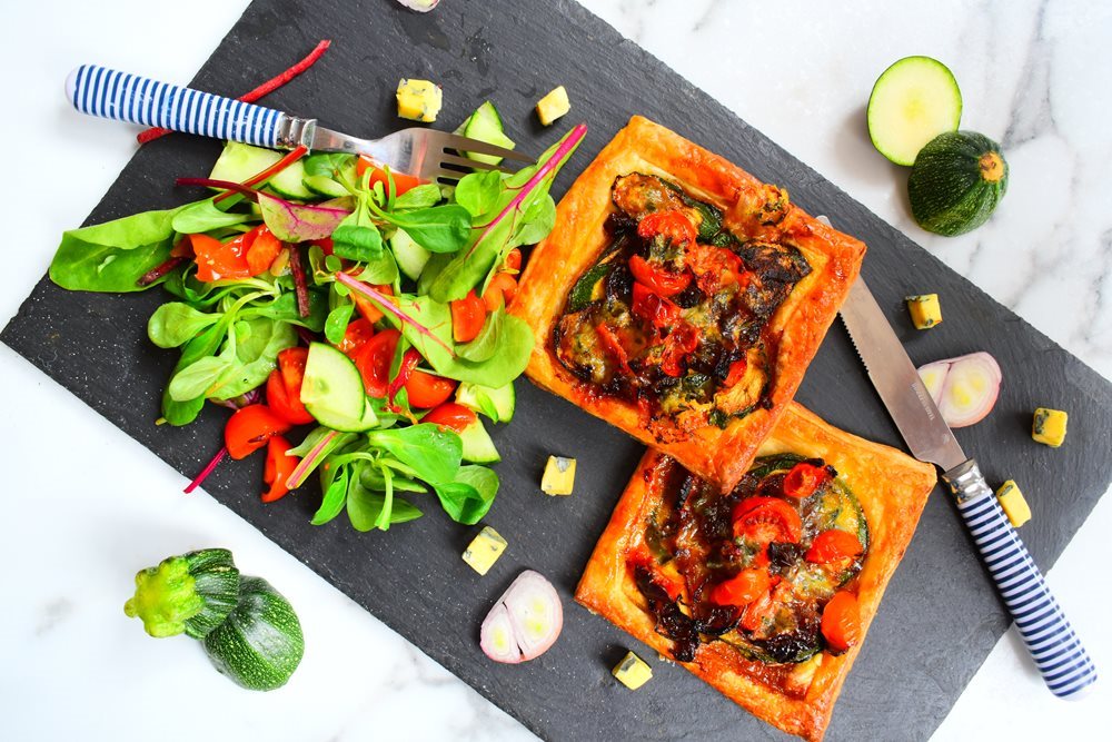 Individual courgette and tomato tartlets with blue cheese