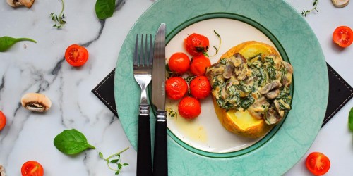 Jacket potato topped with mushrooms & spinach in a mustard & creme fraiche sauce, with roasted cherry tomatoes.