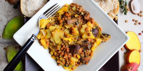 A bowl of veggie green lentil stew with potatoes, mushrooms and leeks