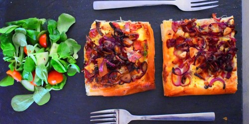 Crème fraiche red onion tart with a tomato and green salad