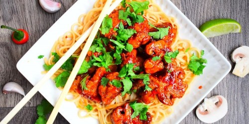 Vegetarian Chinese crispy chilli mushrooms with noodles