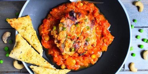 Indian stuffed Mushroom, with spicy tomato sauce and a slice of naan